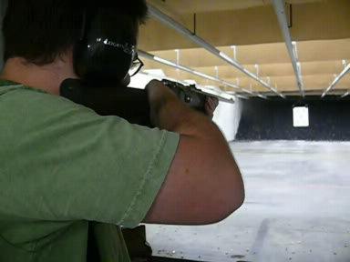 This is a Marlin 980S. It's a .22LR magazine-fed bolt-action rifle. It has a synthetic stock and stainless steel barrel.