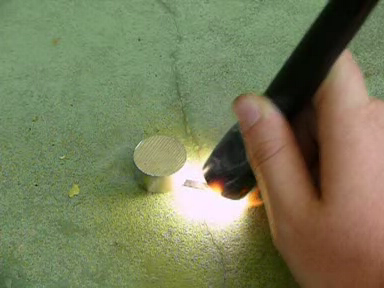 An Auroralite Minimag hotwire igniting a match