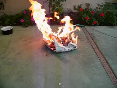 This is a LarryK12 setting some newspaper quite thoroughly on fire